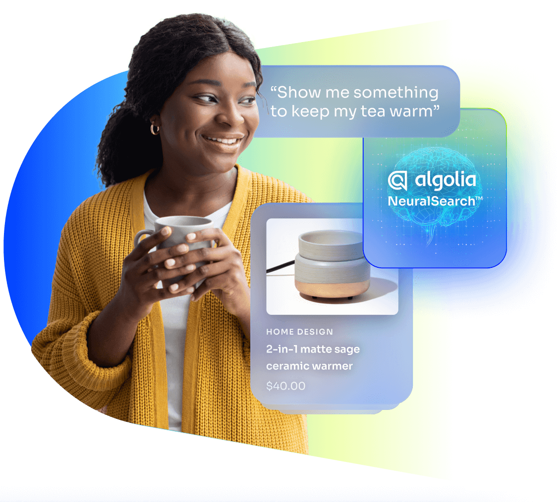 Lady holding a cup of tea, with a search box that reads "Show me something to keep my tea warm", and a result tile for "2-in-1 matte sage ceramic warmer" next to the Algolia NeuralSearch logo.